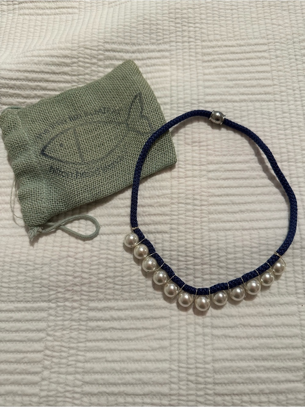 Little Boatique necklace.   Navy cotton cord with pearls.  17 inches.